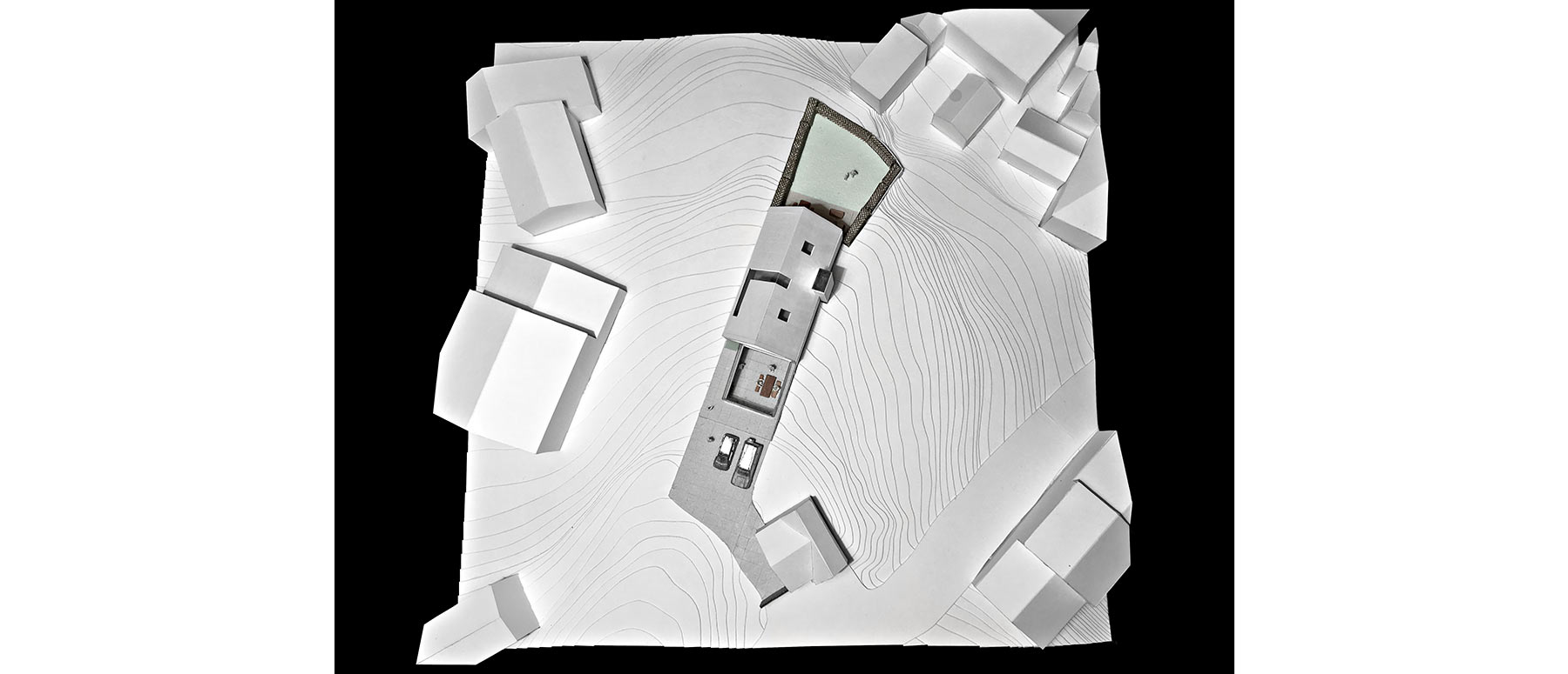 House 148: new build house on a narrow sloping site