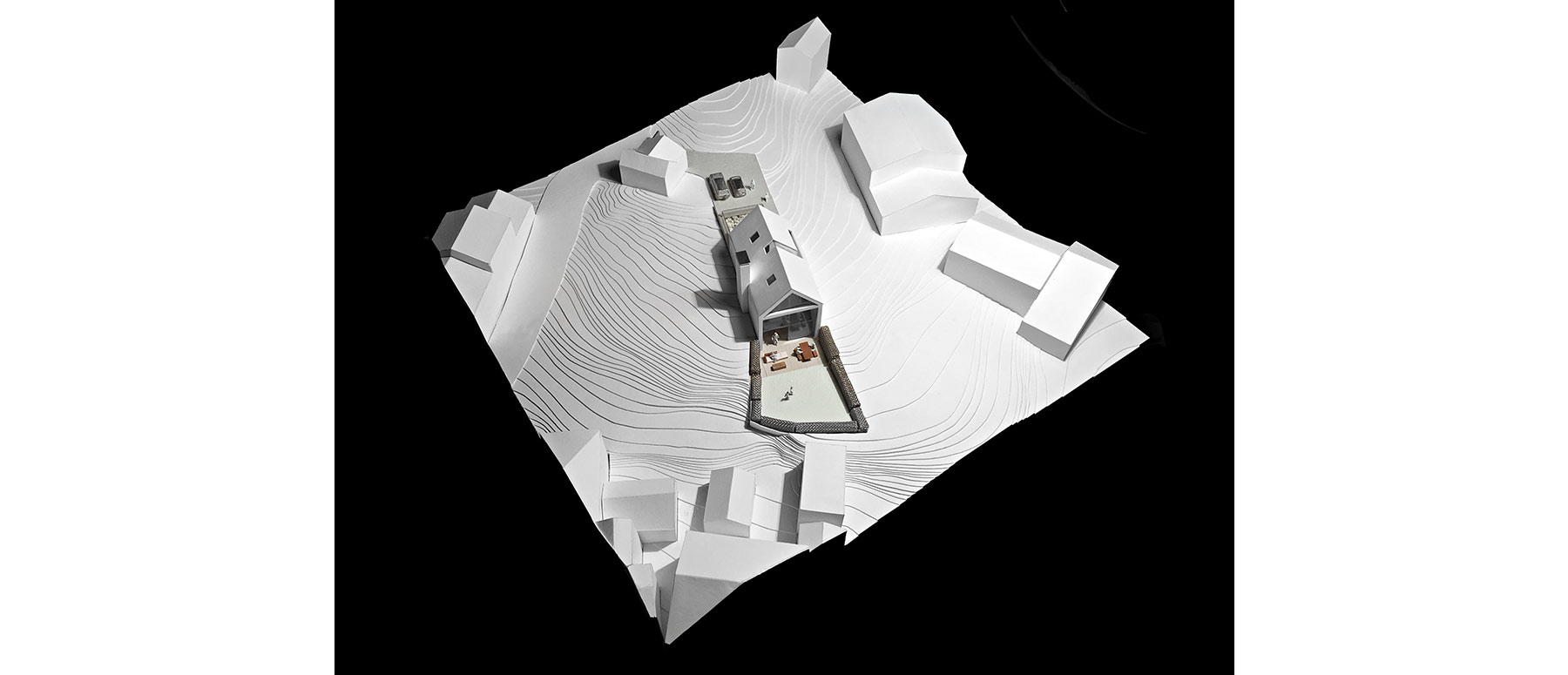 House 148: new build house on a narrow sloping site