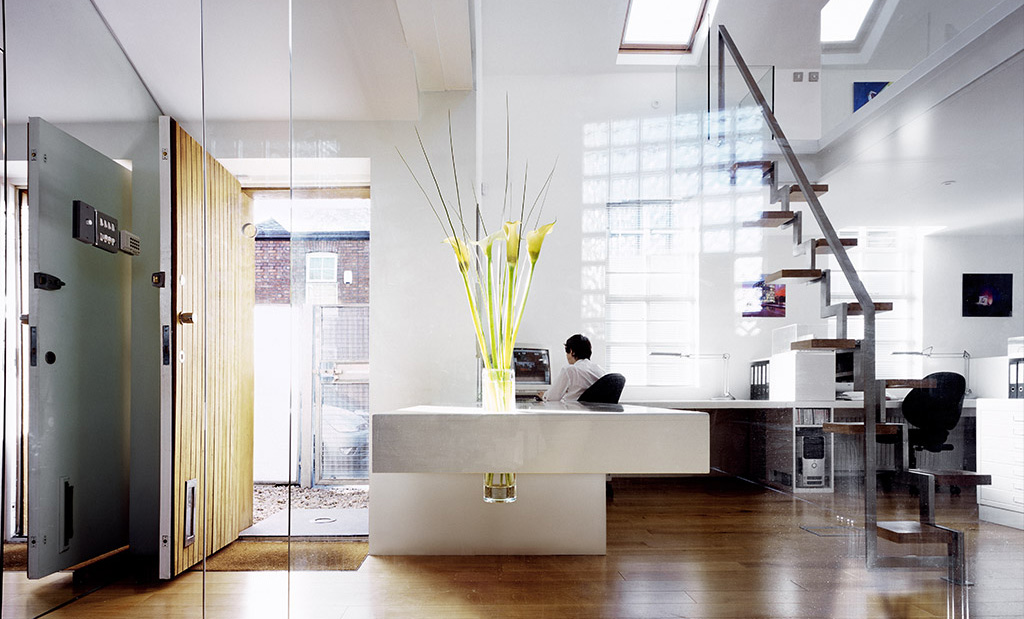 Bright office interior with a feature staircase, designed by Andrew Wallace Architects, Manchester
